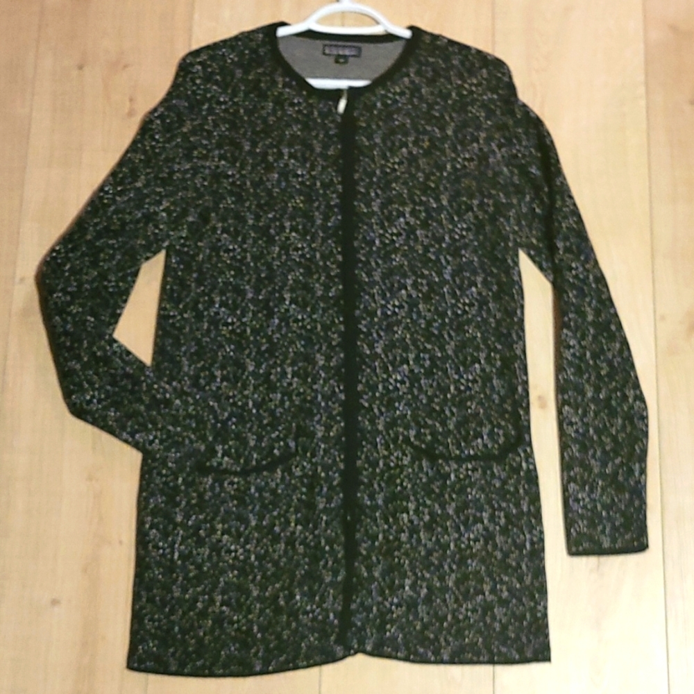 Original Nicole Miller zippered cardigan/sweater with two front pockets.